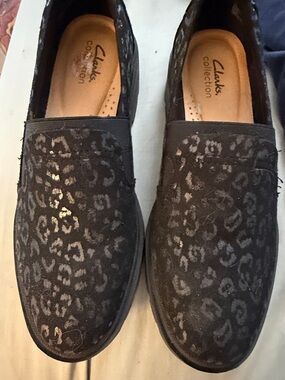 Clarks women’s Black Slip-On Shoes with Subtle Leopard Print